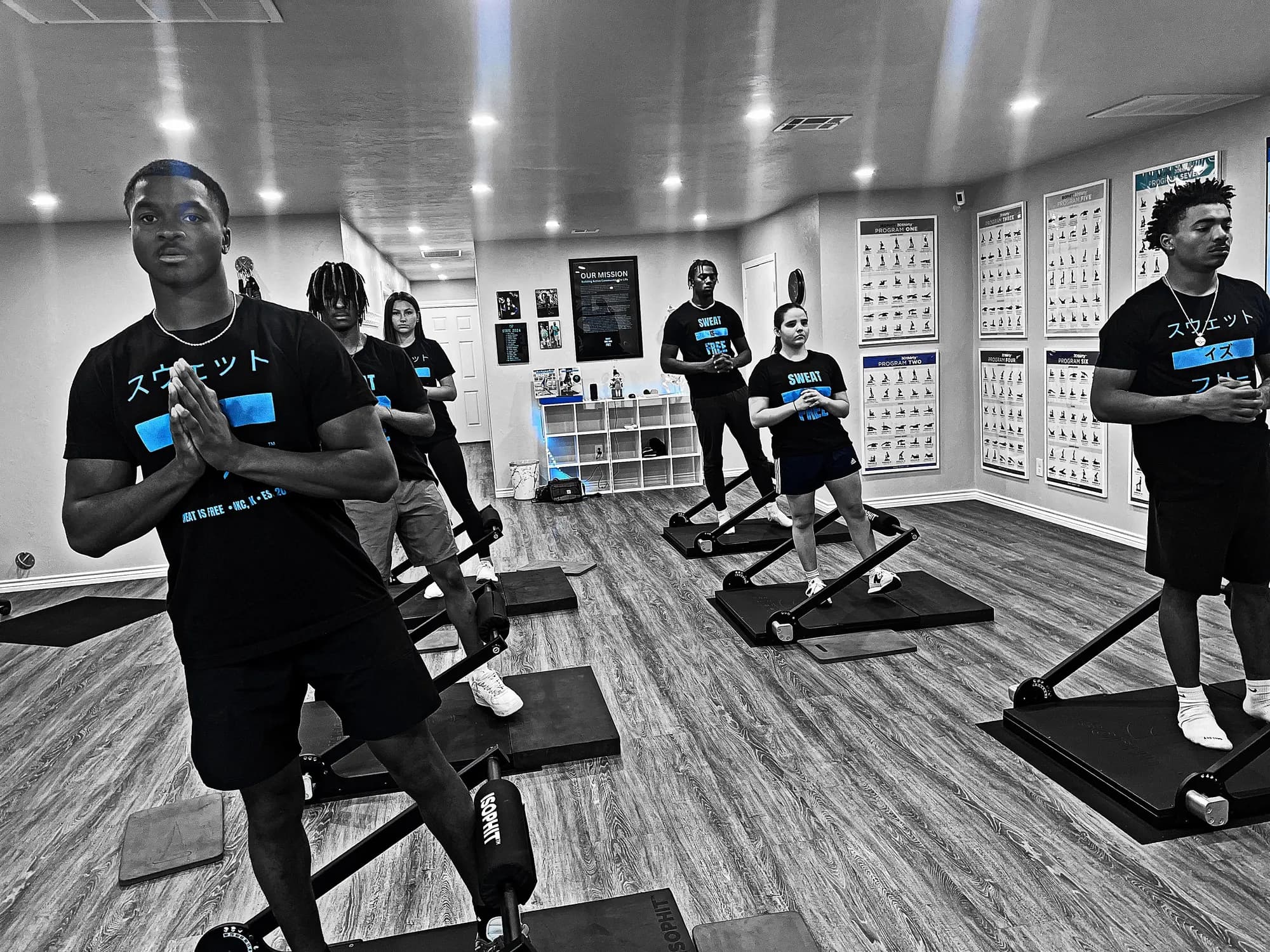 Alpha Shield student athletes training together at Sweat Is Free